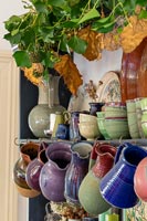 Collection of pottery jugs and bowls on dresser