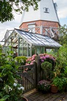 Garden and greenhouse outside old mill house