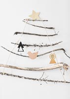 Wall mounted Christmas tree decoration made from twigs