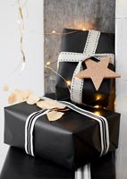 Black and white Christmas gifts with cork star tag