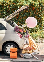 Car with flowers and picnic equipment 