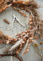 Dried flower and grass wreath with secateurs 