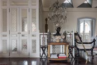 Decorative white doors in eclectic living room 