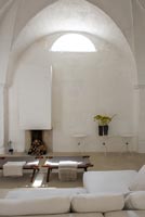 White living room with stone walls 