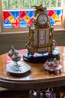 Antique carriage clock on wooden table 