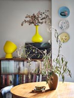 Vase on small round dining table 