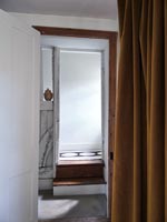 Country hallway with brown curtain room divider 