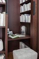 Small desk set into built-in bookshelves