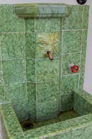 Green tiled water feature - sink 