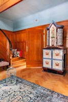 Classic wooden staircase - unusual antique cabinet in hallway 