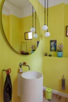 Bright yellow painted modern bathroom 