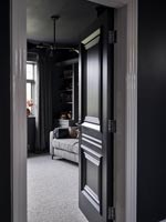 View through black painted internal door 