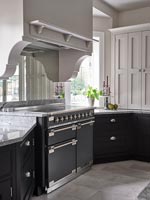 Modern kitchen with large range cooker and concealed extractor hood 