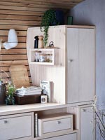 Cupboards in small wooden kitchen