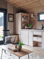 Wooden kitchen in modern open plan living space 