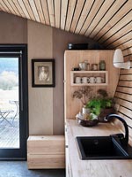 Wooden kitchen in modern open plan living space 