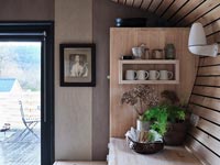 Wooden kitchen with view to terrace