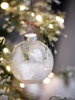 Decorative glass bauble on Christmas tree