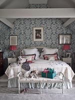 Pet dogs in modern country bedroom at Christmas time 