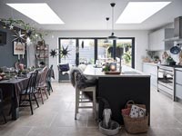 Large island in modern kitchen decorated for Christmas 