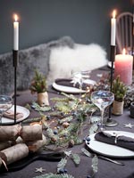 Detail of modern dining table decorated for Christmas 