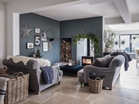Open plan living space with central wood burner 