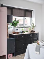 Modern dining room with black sideboard