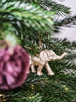 Gold elephant Christmas decoration on tree 