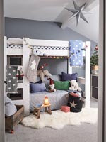 Modern childrens room with white bunkbed decorated for Christmas 