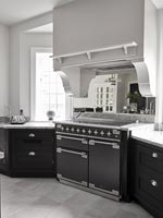 Black and silver range cooker in modern kitchen 