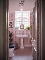 Pink pineapple wallpaper in modern bathroom 