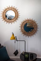 Pair of matching mirrors on wall 