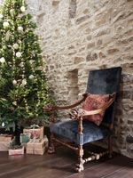 Antique armchair next to Christmas tree