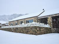 Exterior of country house in snow