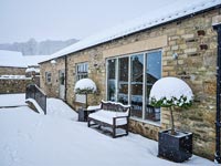 Exterior of country house in snow