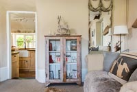 Distressed wooden unit in modern country living room