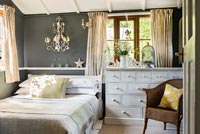 Grey painted wall in modern country bedroom 