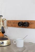 Detail of coffee machine on kitchen worktop 