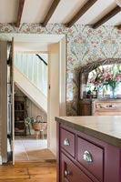 Patterned wallpaper in country kitchen 