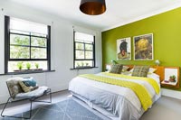 Lime green feature wall in modern bedroom 
