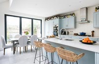 Pale blue modern kitchen-diner 