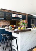 Exposed brick wall in modern kitchen 