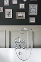 Mixer tap with shower head over bath - detail 