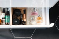 Detail of cosmetics in bathroom drawer