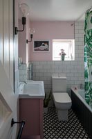 Modern tiled bathroom with patterned floor tiles
