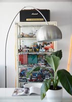 Glass fronted shelving for retro toys and ornaments and retro radio