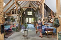 Woman standing in converted barn