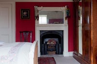 Fireplace in country bedroom 