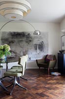 Vintage furniture and large artwork in modern dining room 