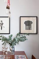 Black and white framed photograph on dining room wall 
